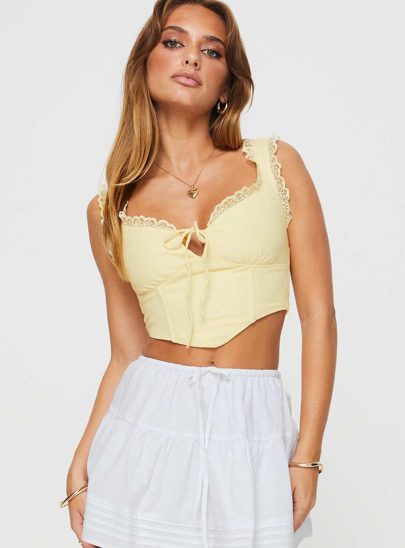 front view of model wearing Princess Polly Scarlett Top Yellow Sleeveless Sweetheart 