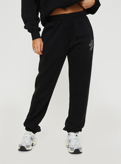 front view of model wearing Princess Polly Princess Polly Track Pants Script Black / Ivory High Waisted Pants 