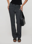 side view of model wearing Princess Polly Allude Low Waist Pinstripe Pant Black Low Rise Pants 