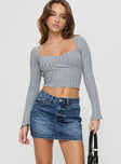   front view of model wearing Princess Polly Arrte Mid Rise Denim Mini Skirt Mid Wash Petite Mini Skirts 