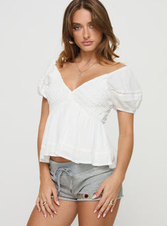 front view of model wearing Princess Polly Gizmo Top White Short Sleeves Plunger 