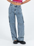 Front view of model wearing  front Princess Polly Mid Rise  Vandana Cargo Jeans Mid Wash Denim