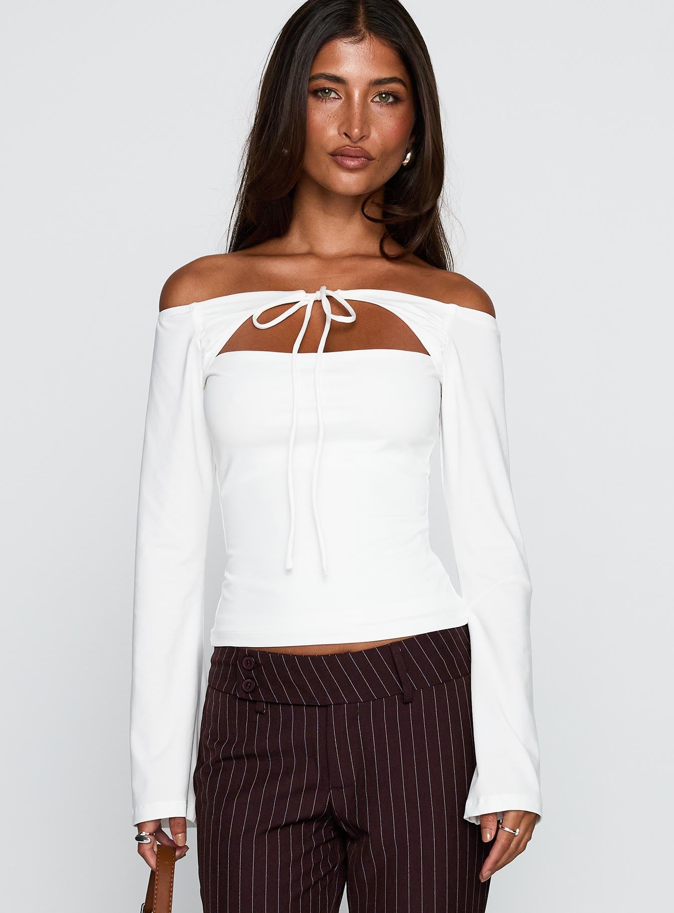 front view of model wearing Princess Polly Nevah Long Sleeve Top White Full Sleeves straight 