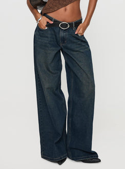 side view of model wearing Princess Polly Low Rise Wide Leg Jean Hocus Pocus Wash Low Rise Jeans 