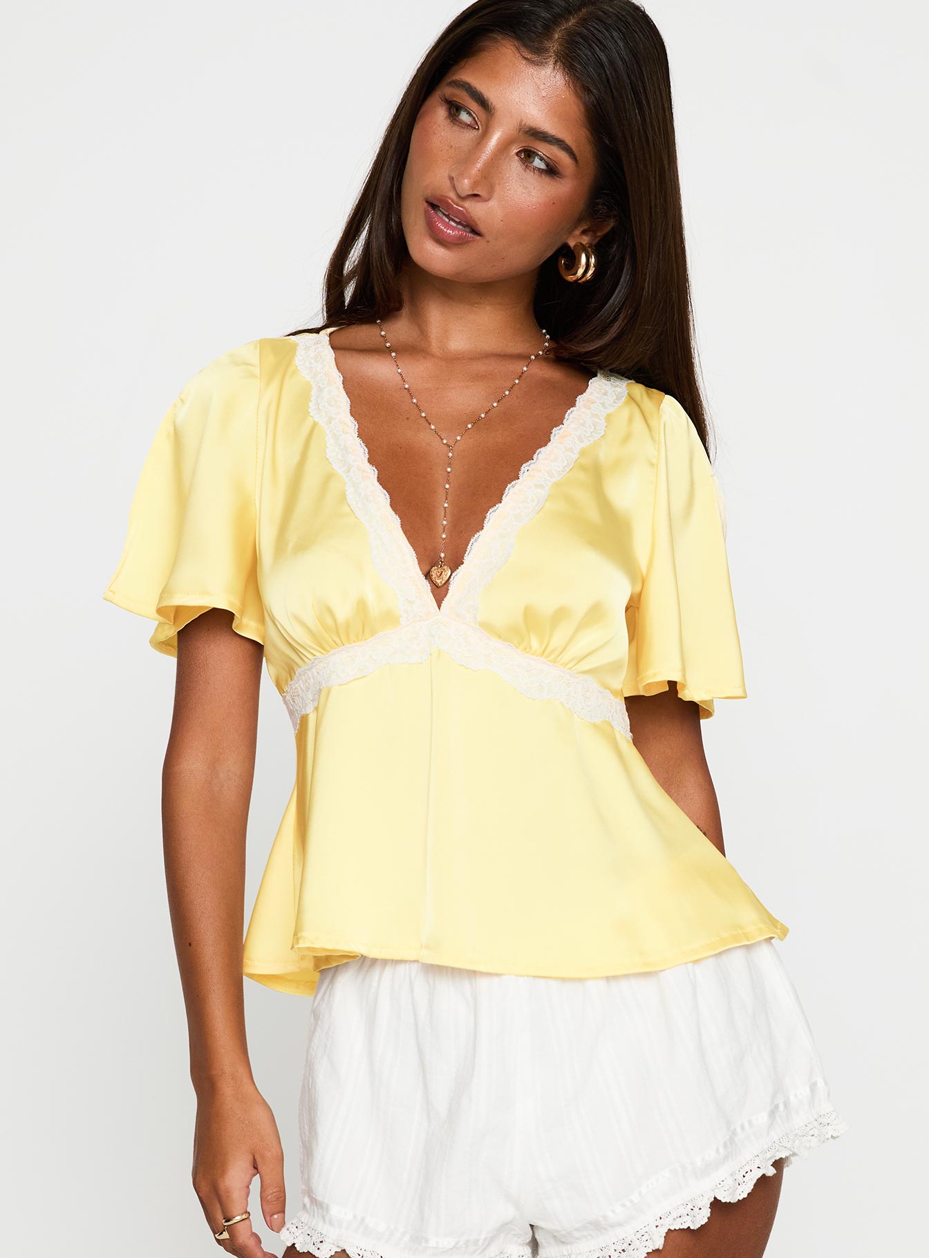 front view of model wearing Princess Polly For The Summer Lace Trim Top Yellow Short Sleeves Plunger 