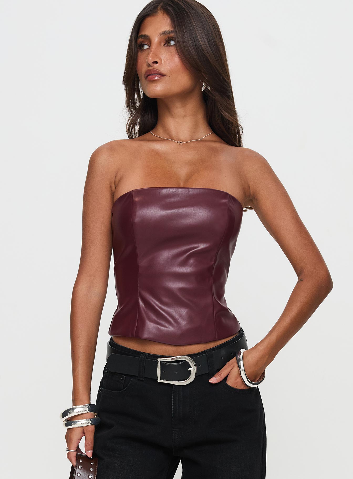 front view of model wearing Princess Polly Oaklee Strapless Faux Leather Top Burgundy Sleeveless straight 