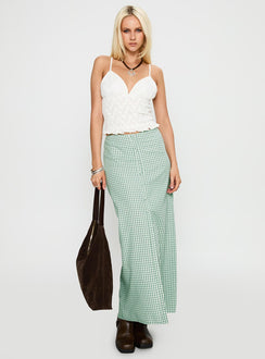   side view of model wearing Princess Polly Macadamia Maxi Skirt Green / White Maxi 