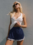 side view of model wearing Princess Polly Longer Days Short Navy High Waisted Shorts 