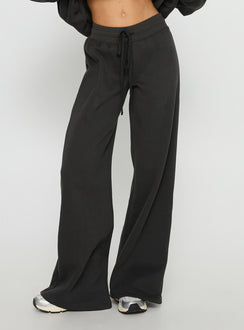 side view of model wearing Princess Polly Princess Polly Stargirl Wide Leg Sweat Pants Charcoal High Rise Pants 