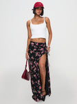   side view of model wearing Princess Polly Rhomana Maxi Skirt Black Floral Maxi 