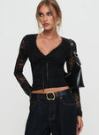 front view of model wearing Princess Polly Temptation Incoming Long Sleeve Lace Top Black Full Sleeves V-Neck 