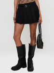   side view of model wearing Princess Polly Sydnea Pleat Mini Skirt Black Mini Skirts 