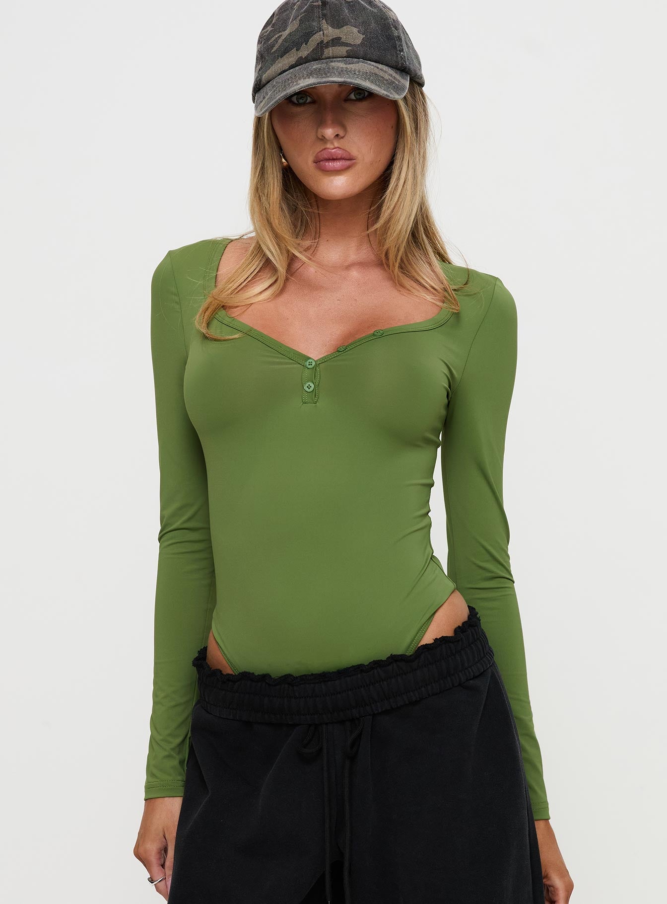 front view of model wearing Princess Polly Delgado Long Sleeve Bodysuit Olive Full Sleeves 