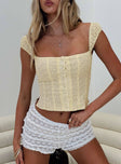 front view of model wearing Princess Polly Lyncher Top Yellow Short Sleeves Square Neck 