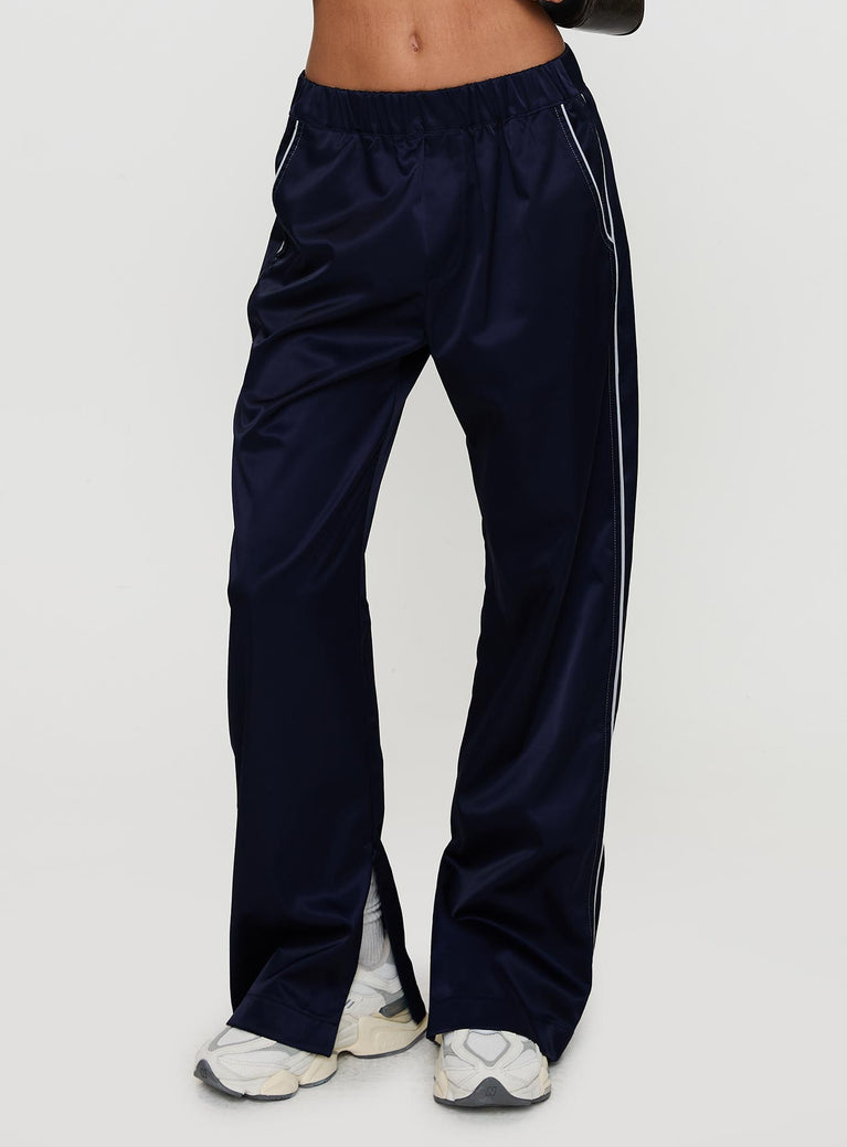 side view of model wearing Princess Polly Travalta Satin Track Pant Navy Low Rise Pants 