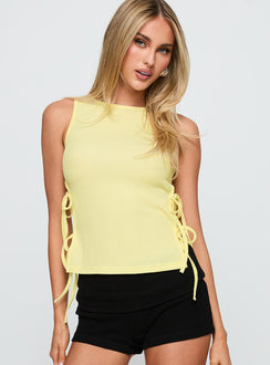 front view of model wearing Princess Polly Dignity Tie Side Top Yellow Sleeveless Crew Neck 