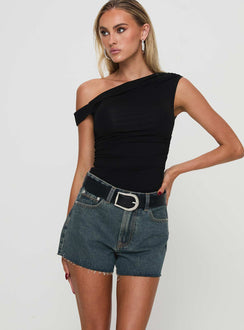 side view of model wearing Princess Polly Get It Right Mid Rise Denim Shorts Dark Denim Wash High Waisted Shorts 