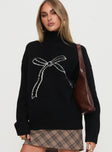 front view of model wearing Princess Polly Shes So Sweet Bow Knit Sweater Black 