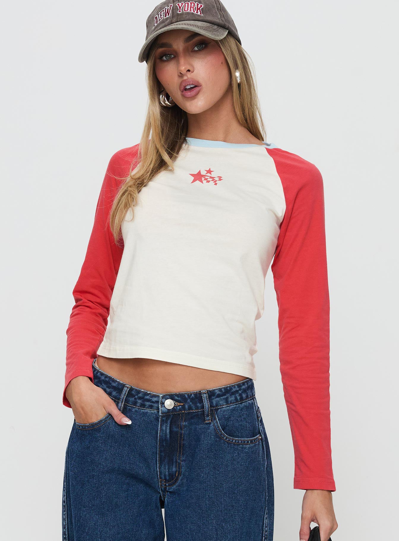 front view of model wearing Princess Polly Racing Star Long Sleeve Top Red Full Sleeves Crew Neck 
