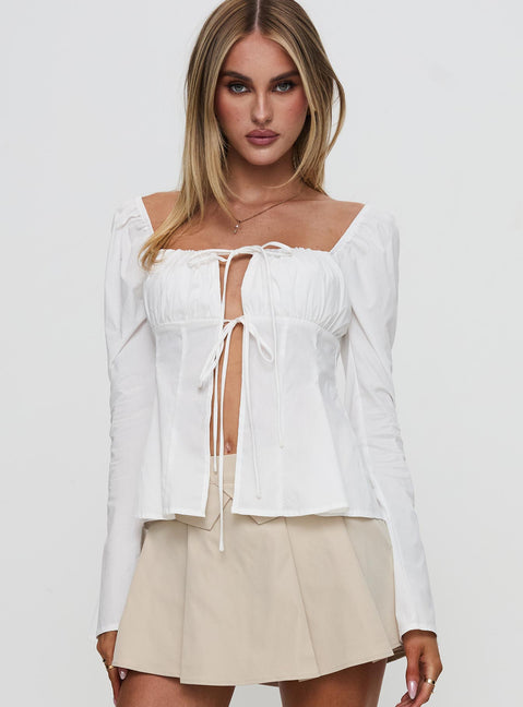 front view of model wearing Princess Polly Lilibette Tie Up Long Sleeve Top White Full Sleeves Square Neck 