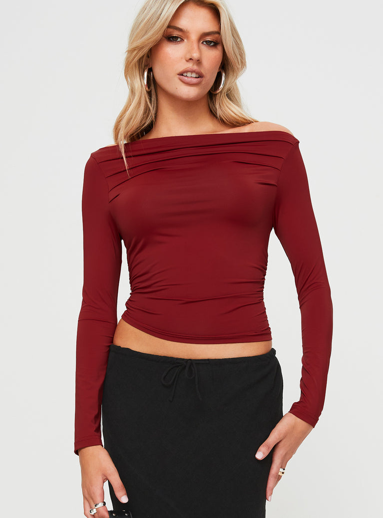 front view of model wearing Princess Polly Matrid Long Sleeve Top Burgundy Full Sleeves Asymmetric Neckline 