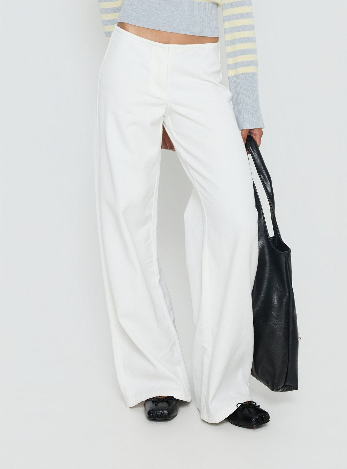 back view of model wearing Princess Polly Hereos Mid Rise Baggy Leg Jeans White Mid Rise Jeans Jeans 