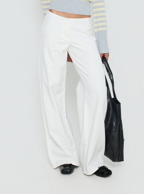 back view of model wearing Princess Polly Hereos Mid Rise Baggy Leg Jeans White Mid Rise Jeans Jeans 