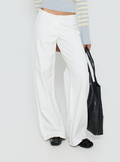 back view of model wearing Princess Polly Hereos Mid Rise Baggy Leg Jeans White Mid Rise Jeans 