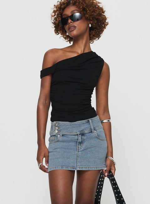   side view of model wearing Princess Polly Brinkman Mini Skirt Light Wash Denim Mini Skirts 
