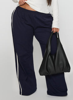 back view of model wearing Princess Polly Circuit Track Pants Navy Curve 