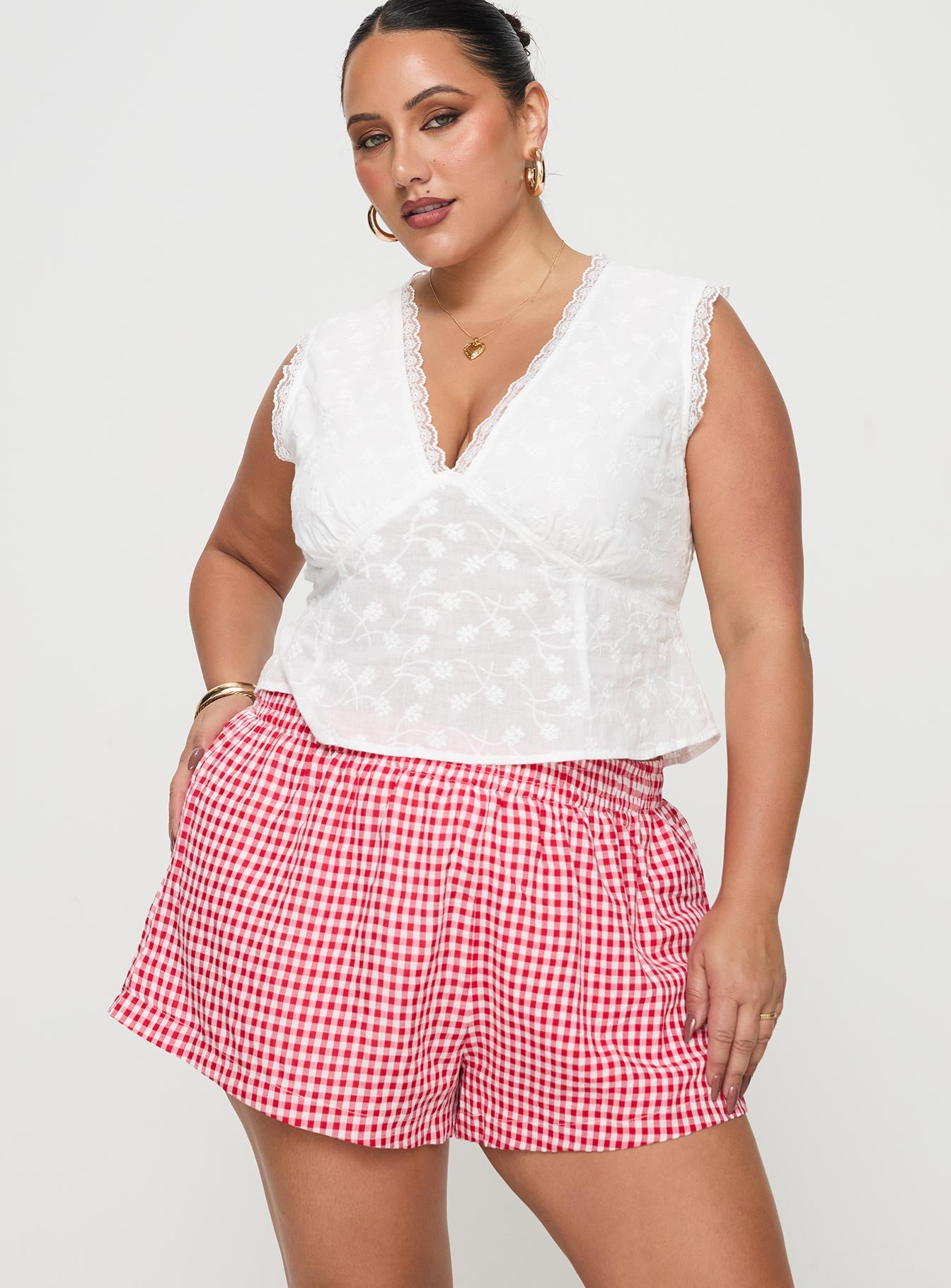 front view of model wearing Princess Polly Beach House Shorts Red / White Gingham Curve 