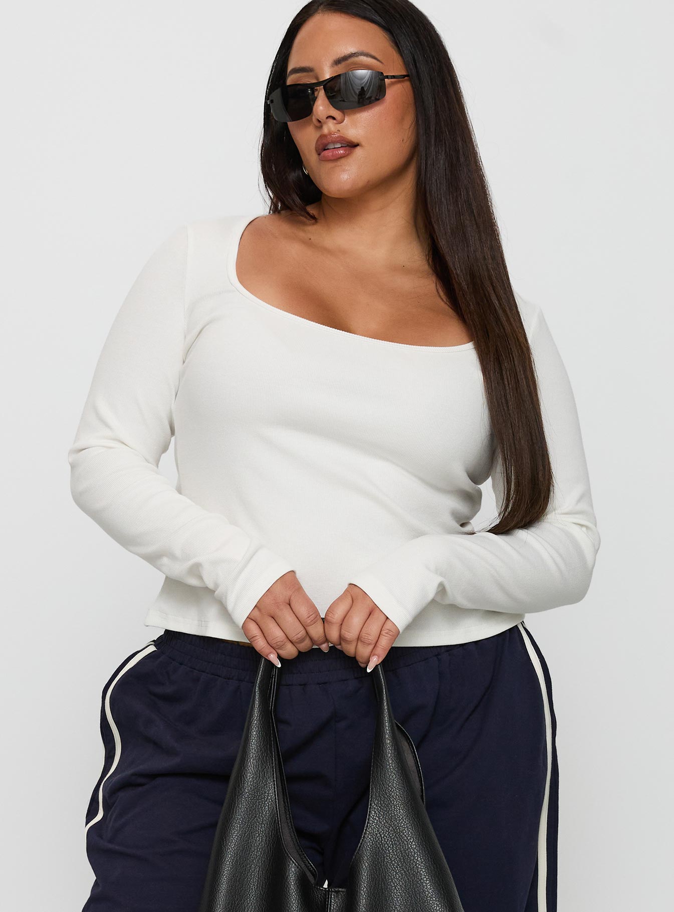 side view of model wearing Princess Polly Baseline Long Sleeve Top White Curve Full Sleeves Square Neck 