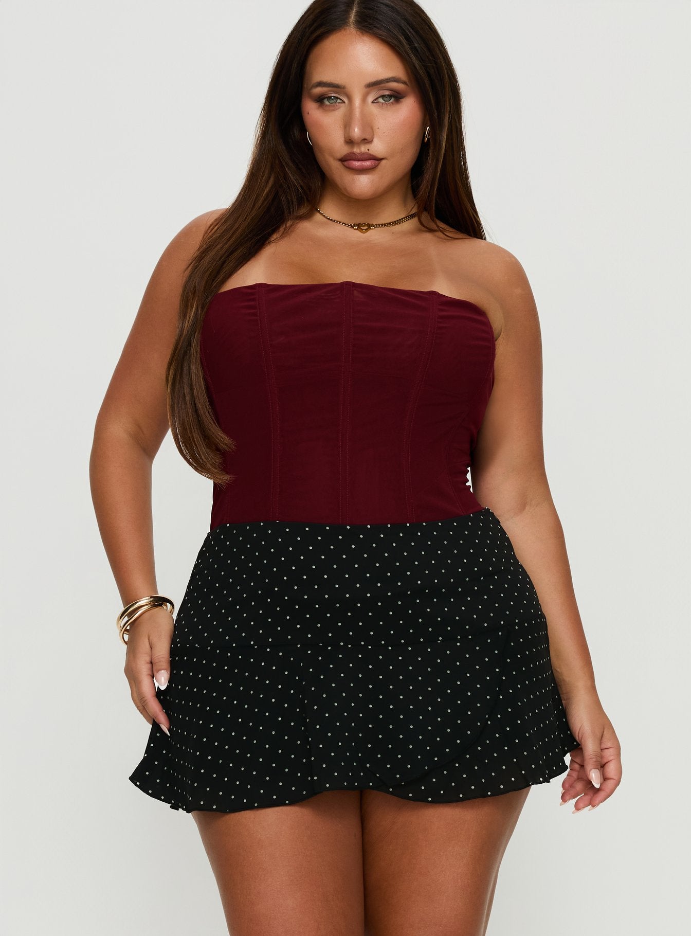   front view of model wearing Princess Polly Sonsie Mini Skirt Black / White Polka Curve 