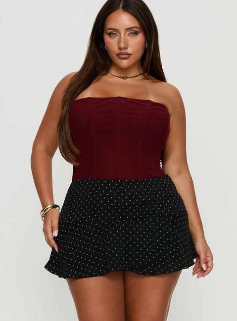  front view of model wearing Princess Polly Sonsie Mini Skirt Black / White Polka Curve 