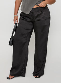 front view of model wearing Princess Polly First Place Low Rise Satin Pant Black Curve Low Rise Pants 