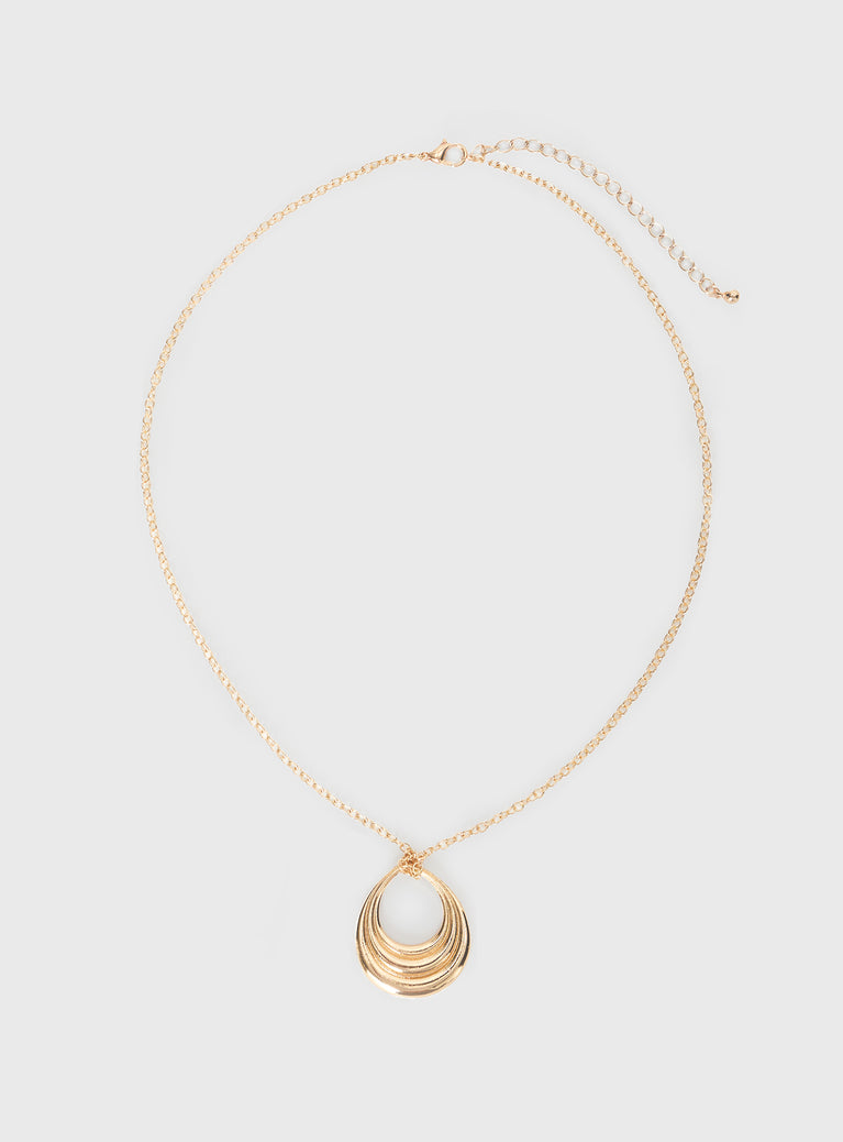 Gold toned pendant necklace