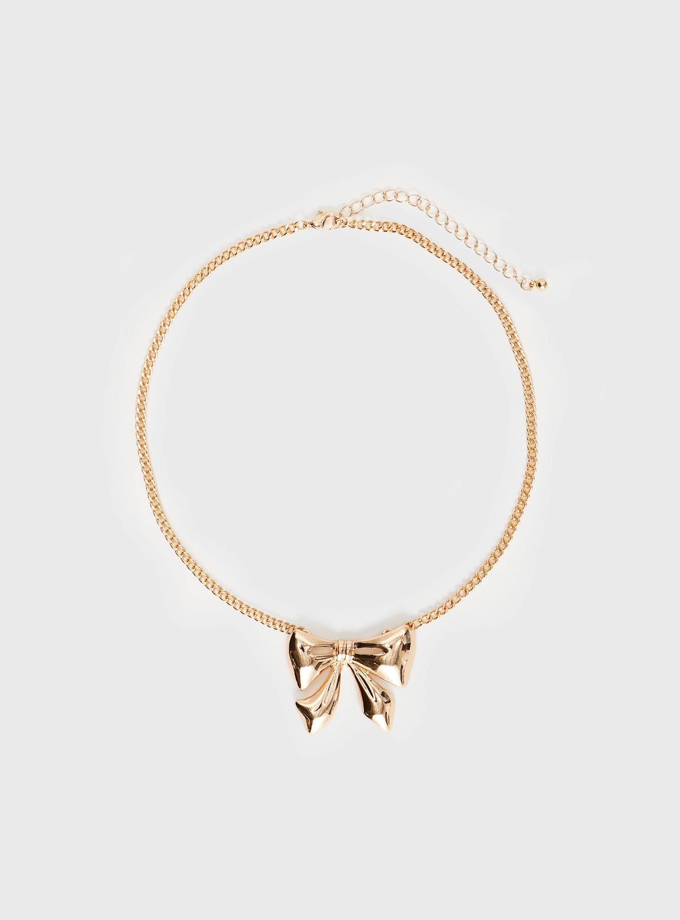Gold-toned necklace Bow charm, lobster clasp fastening