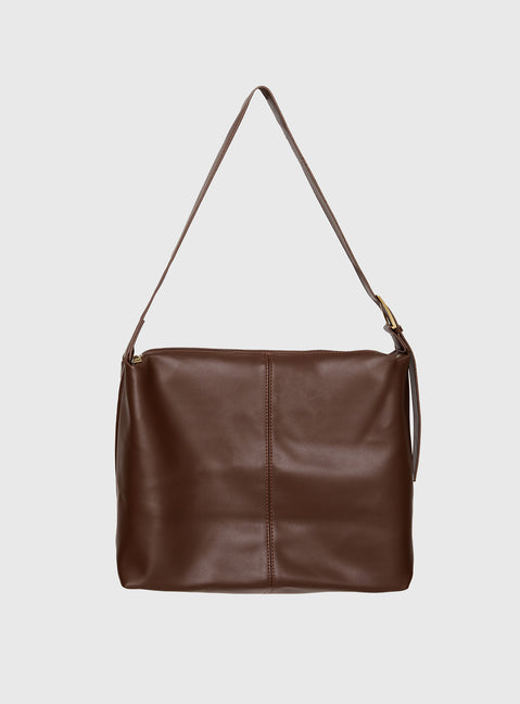 Faux leather bag  Adjustable shoulder strap, gold-toned buckle, single internal pocket with zip fastening, fully lined