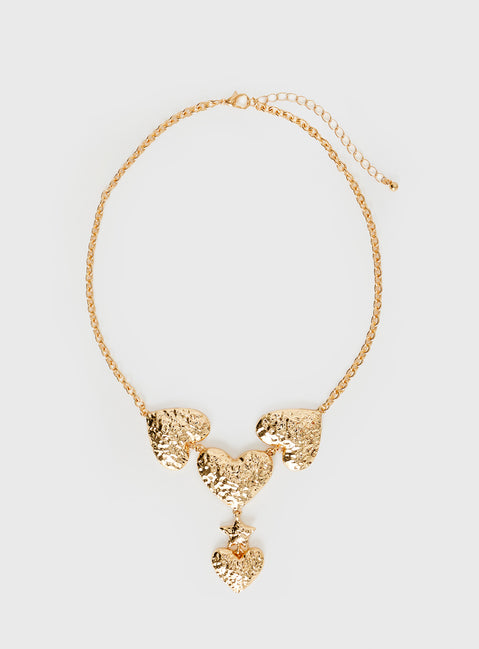 Gold-toned necklace Chunky design, heart pendants, lobster clasp fastening