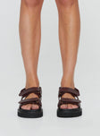 Sandals Faux leather material, twin velcro upper, chunky treaded sole, padded footbed Ankle strap with velcro fastening