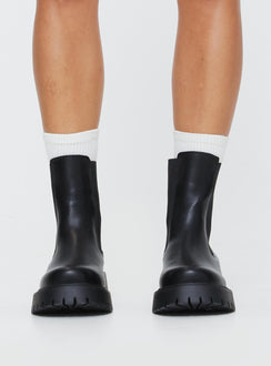 Faux leather boots Rounded toe, treaded sole, pull tab at back, passed footbed