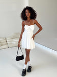 Front view of model wearing  front Princess Polly Square Neck  Liburd Bow Mini Dress White