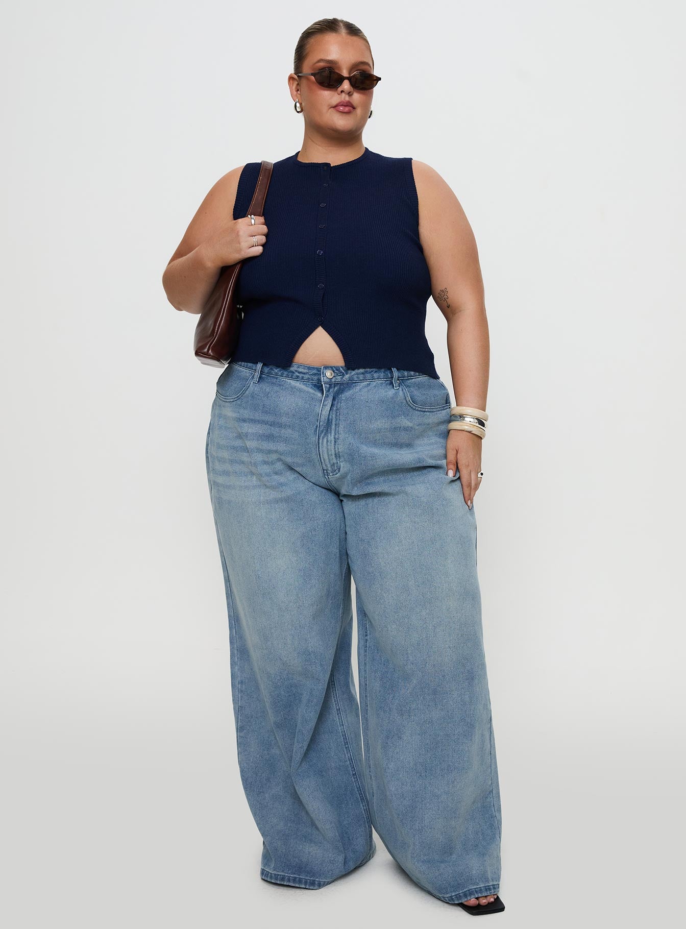 front view of model wearing Princess Polly Suzu Sleeveless Top Navy Curve Sleeveless Crew Neck 