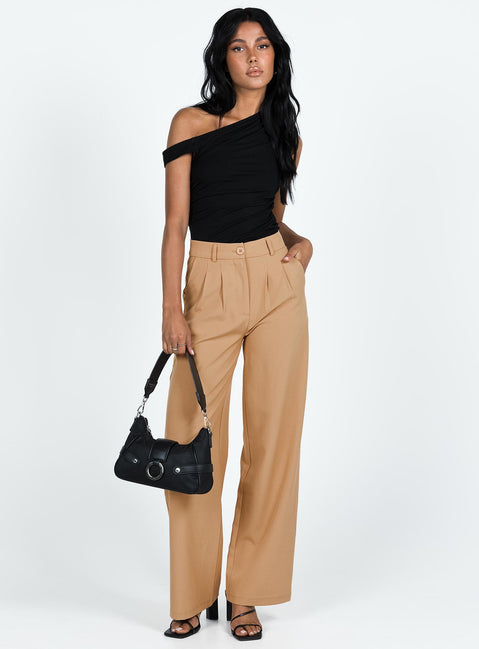 Front view of model wearing  front Princess Polly High Waisted Pants  Archer Pants Camel