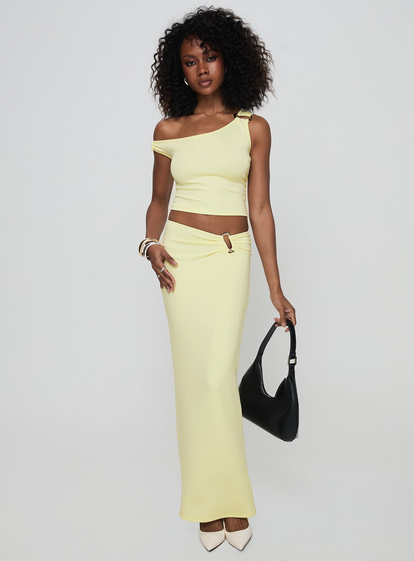 front view of model wearing Princess Polly Rios One Shoulder Top Cream Sleeveless Asymmetric Neckline 