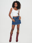 side view of model wearing Princess Polly Crystal Bay Skort Mid Wash High Waisted Shorts 