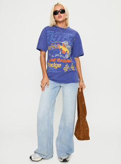 side view of model wearing Princess Polly Dodge 1969 Oversized Graphic Top Blue Half Sleeves Crew Neck 