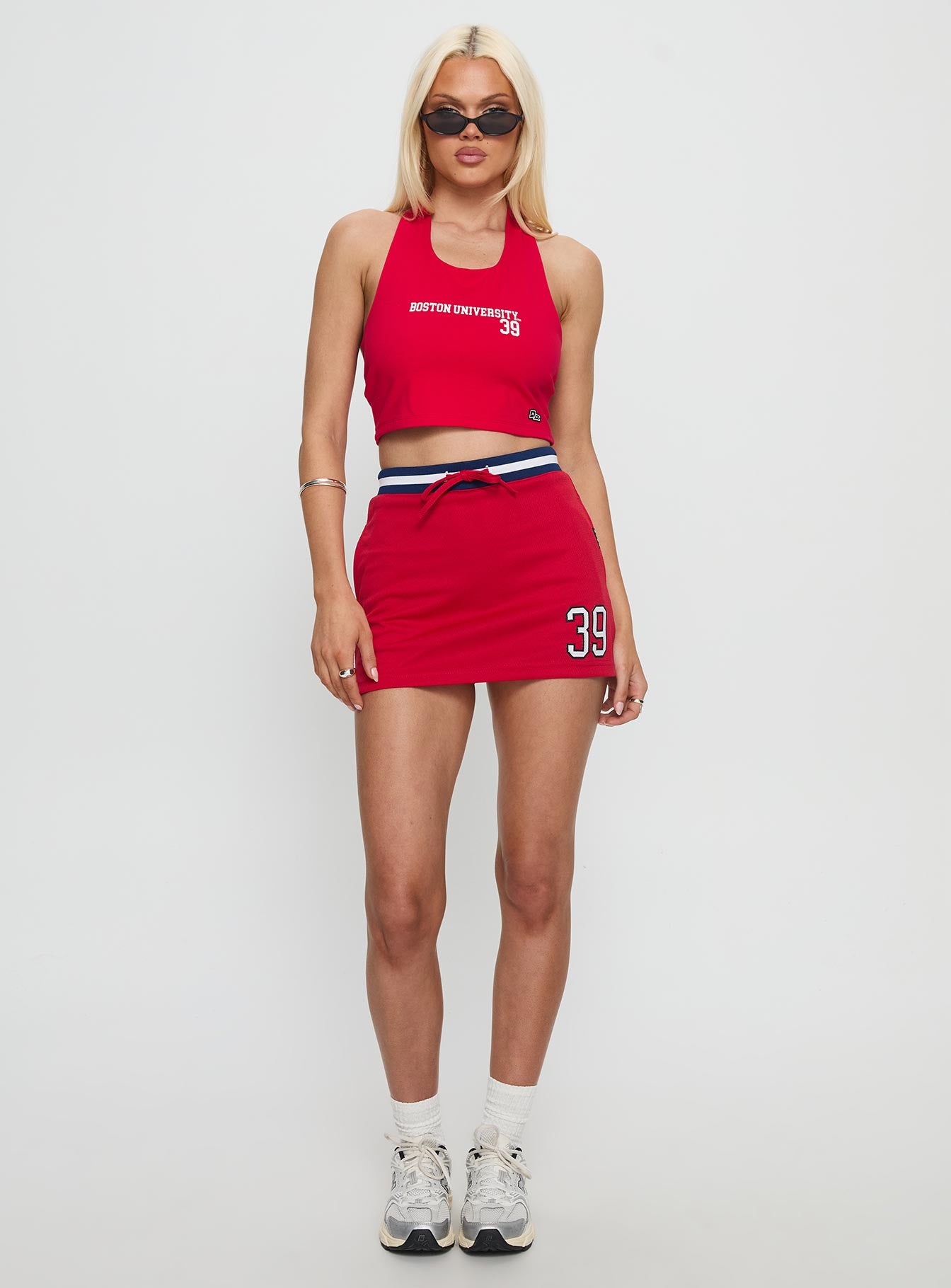   front view of model wearing Princess Polly Boston University Basketball Skirt Red Mini Skirts 