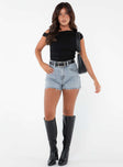 front view of model wearing Princess Polly Laurena Denim Shorts Petite Lower Impact High Waisted Shorts 