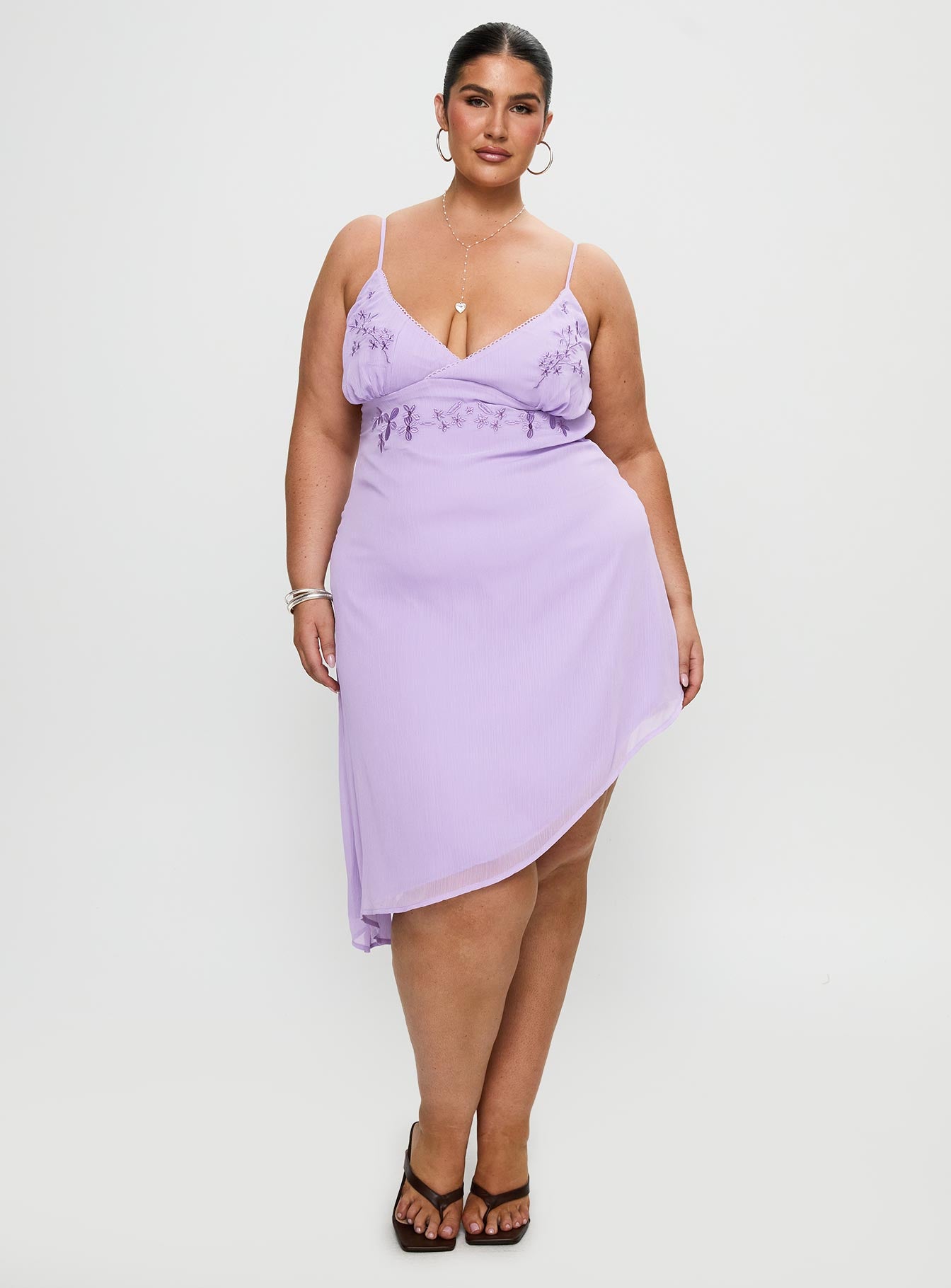 side view of model wearing Princess Polly Secret Gardens Asymmetrical Midi Dress Purple Curve Plunger 